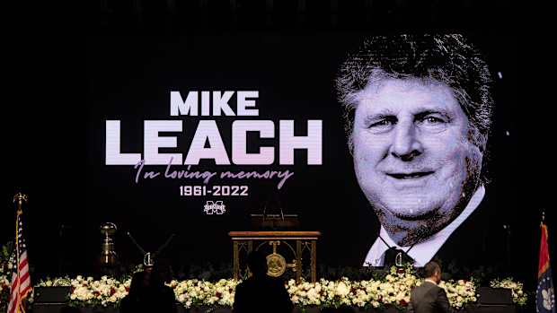 Last-minute preparations continue for the Mike Leach memorial service in Humphrey Coliseum at Mississippi State in Starkville, Miss.