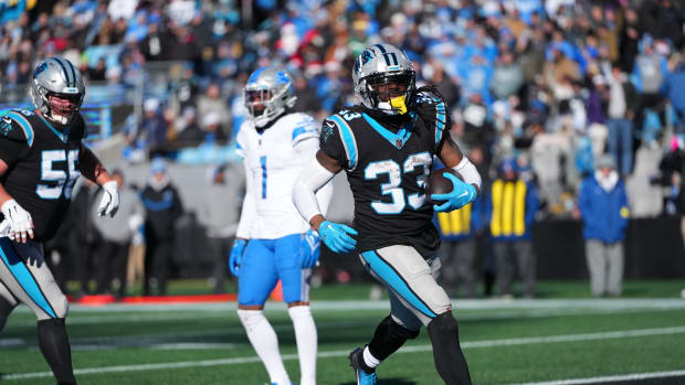 Panthers running back D'Onta Foreman scores a touchdown against the Lions in Week 16.