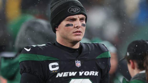 New York Jets QB Zach Wilson standing on sideline after getting benched