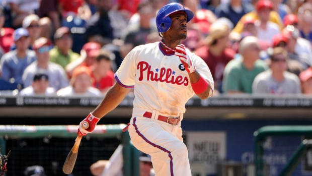 Phillies shortstop Jimmy Rollins singles during the seventh inning against the Braves at Citizens Bank Park.