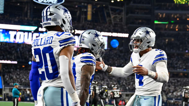 Dec 24, 2022; Arlington, Texas, USA; Dallas Cowboys wide receiver CeeDee Lamb (88) and running back Tony Pollard (20) and quarterback Dak Prescott (4) celebrate after Lamb catches a pass for a touchdown against the Philadelphia Eagles during the second half at AT&T Stadium.