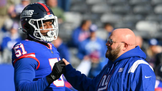 Dec 4, 2022; East Rutherford, New Jersey, USA; New York Giants head coach Brian Daboll greets linebacker Azeez Ojulari (51) prior to the game against the Washington Commanders at MetLife Stadium.