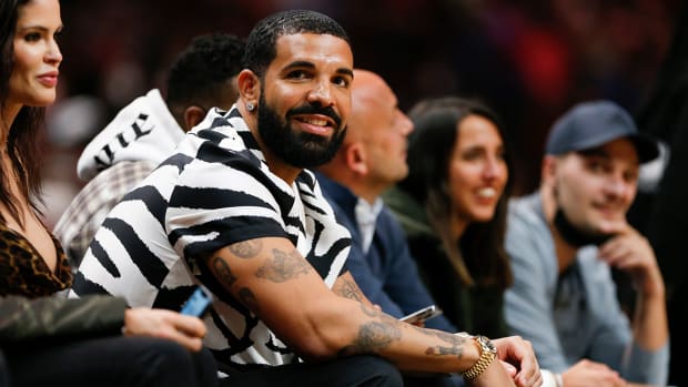 Canadian rapper Drake attends the game between the Heat and the Hawks at FTX Arena.