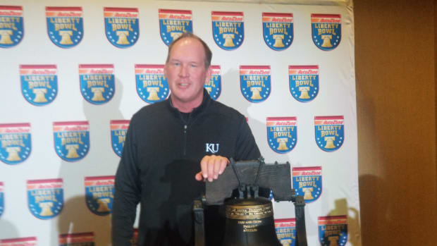 Lance Leipold with the AutoZone Liberty Bowl trophy prior to the matchup between the Kansas Jayhawks and the Arkansas Razorbacks.