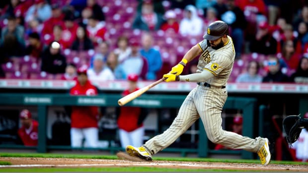 Padres first baseman Eric Hosmer hits a two-run home run in the fourth inning against the Reds at Great American Ball Park in Cincinnati on Tuesday, April 26, 2022.