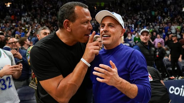 Timberwolves co-minority owners Alex Rodriguez and Marc Lore celebrate a victory over the Clippers.