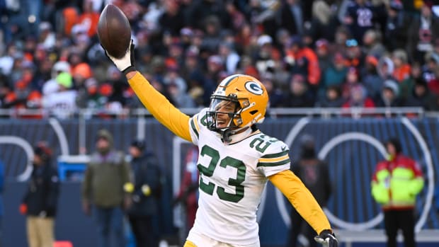 Packers cornerback Jaire Alexander (23) celebrates after making an interception during a game against the Bears.