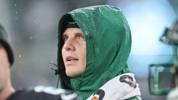 New York Jets QB Zach Wilson stands on sideline after being benched