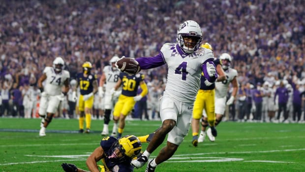 TCU wide receiver Taye Barber (4) runs for a touchdown against Michigan during the first half at the Fiesta Bowl at State Farm Stadium