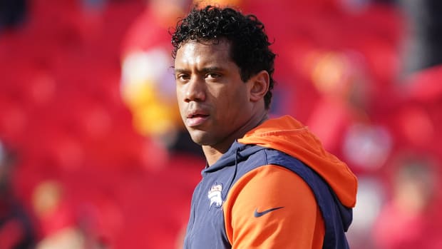 Broncos quarterback Russell Wilson (3) warms up against the Chiefs prior to a game at GEHA Field at Arrowhead Stadium.