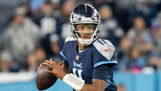 Tennessee Titans quarterback Joshua Dobbs (11) rolls out of the pocket during the second quarter of the game against the Dallas Cowboys at Nissan Stadium Thursday, Dec. 29, 2022, in Nashville, Tenn.