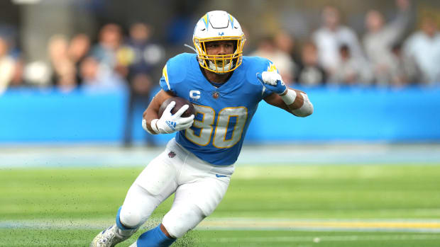 Jan 1, 2023; Inglewood, California, USA; Los Angeles Chargers running back Austin Ekeler (30) carries the ball in the first half against the Los Angeles Rams at SoFi Stadium. Mandatory Credit: Kirby Lee-USA TODAY Sports