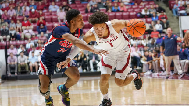 Alabama Crimson Tide guard Mark Sears (1) drives to the basket against Mississippi Rebels guard Daeshun Ruffin (24) during the second half at Coleman Coliseum.