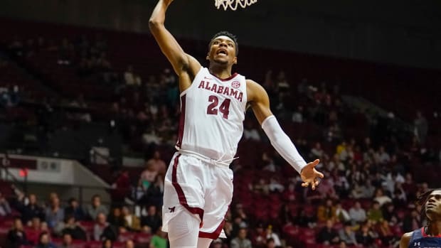 Alabama Crimson Tide forward Brandon Miller (24) goes the net against the Jackson State Tigers during the second half at Coleman Coliseum.