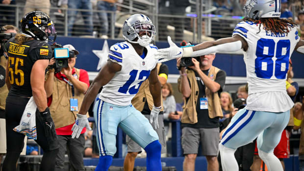 Oct 2, 2022; Arlington, Texas, USA; Dallas Cowboys wide receiver Michael Gallup (13) and wide receiver CeeDee Lamb (88) celebrate after Gallup catches a pass for a touchdown against the Washington Commanders during the second quarter at AT&T Stadium.