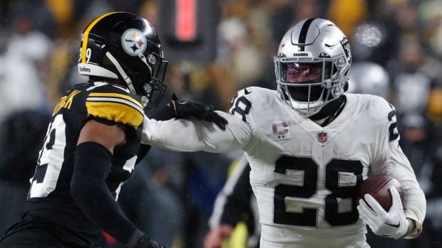 Las Vegas Raiders running back Josh Jacobs (28) carries the ball against Pittsburgh Steelers safety Minkah Fitzpatrick (39) during the third quarter at Acrisure Stadium in 2022. The Steelers won 13-10.