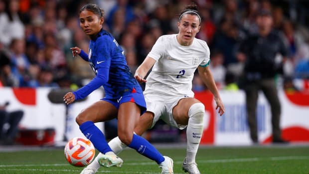 Alyssa Thompson of USA and Lucy Bronze of England in action during the International Friendly match at Wembley Stadium, London