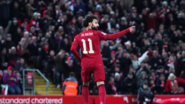 Mo Salah pictured celebrating after scoring for Liverpool against Wolves in an FA Cup third round game in January 2023