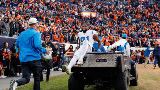 Jan 8, 2023; Denver, Colorado, USA; Los Angeles Chargers wide receiver Mike Williams (81) is carted off the field in the second quarter against the Denver Broncos at Empower Field at Mile High. Mandatory Credit: Isaiah J. Downing-USA TODAY Sports