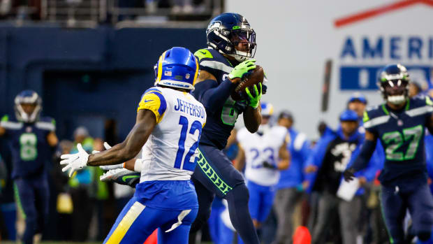 Seattle Seahawks safety Quandre Diggs (6) intercepts a pass intended for Los Angeles Rams wide receiver Van Jefferson (12) during overtime at Lumen Field.