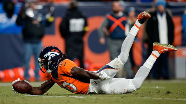 Jan 8, 2023; Denver, Colorado, USA; Denver Broncos wide receiver Jerry Jeudy (10) dives to recover a fumble in the fourth quarter against the Los Angeles Chargers at Empower Field at Mile High. Mandatory Credit: Isaiah J. Downing-USA TODAY Sports