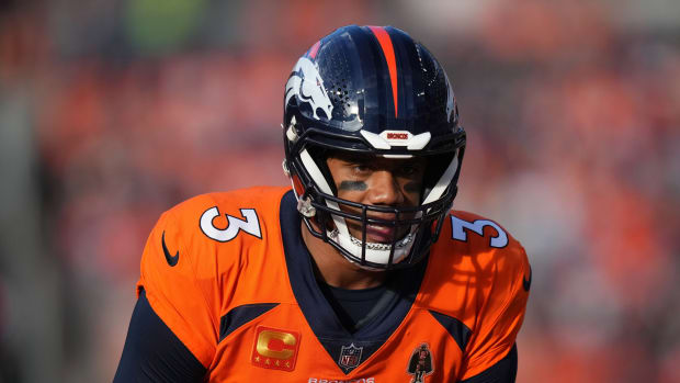 Denver Broncos quarterback Russell Wilson (3) calls out in from the line of scrimmage in the first quarter against the Los Angeles Chargers at Empower Field at Mile High.