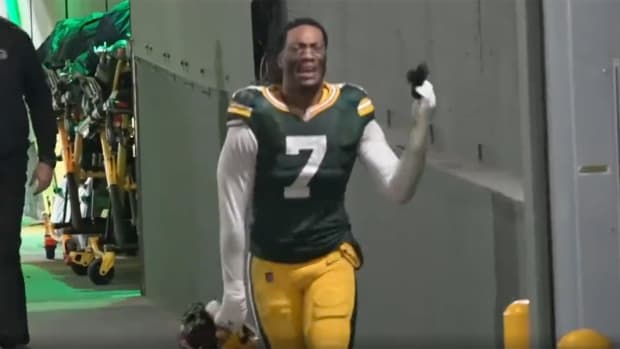 Packers linebacer Quay Walker crying in the tunnel after being ejected against the Lions.