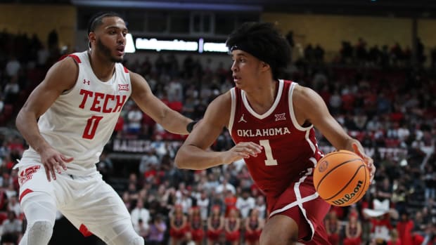 Jan 7, 2023; Lubbock, Texas, USA; Oklahoma Sooners forward Jalen Hill (1) dribbles the ball against Texas Tech Red Raiders forward Kevin Obanor (0) in the second half at United Supermarkets Arena.
