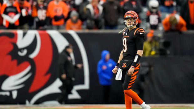 Cincinnati Bengals quarterback Joe Burrow (9) comes off the field on fourth down in the fourth quarter of the NFL Week 18 game between the Cincinnati Bengals and the Baltimore Ravens at Paycor Stadium in downtown Cincinnati on Sunday, Jan. 8, 2023. The Bengals clinched a home playoff game with a 27-16 win over the Ravens. Baltimore Ravens At Cincinnati Bengals Nfl Week 18