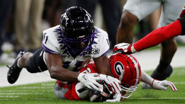 Georgia defensive back Javon Bullard (22) recovers the ball for a turnover during the first half of the NCAA College Football National Championship game between TCU and Georgia.