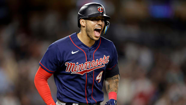 Twins’ Carlos Correa reacts after hitting a two-run home run against Yankees.