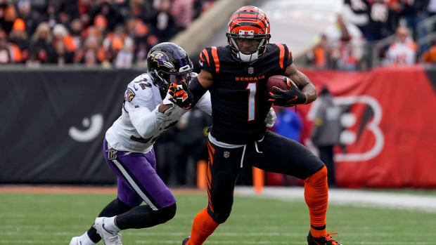 Cincinnati Bengals wide receiver Ja’Marr Chase (1) breaks away from Baltimore Ravens safety Marcus Williams (32) on a reception in the first quarter of the NFL Week 18 game between the Cincinnati Bengals and the Baltimore Ravens at Paycor Stadium in downtown Cincinnati on Sunday, Jan. 8, 2023.