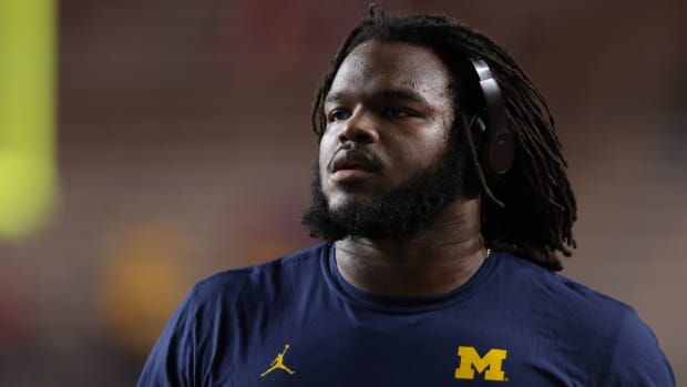 Michigan defensive tackle Mazi Smith warms up before a game.
