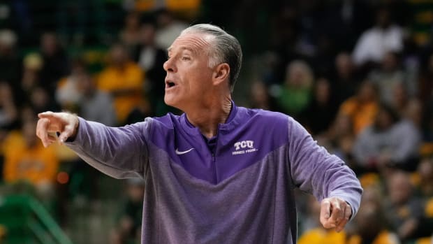 Jan 4, 2023; Waco, Texas, USA; TCU Horned Frogs head coach Jamie Dixon calls a play against the Baylor Bears during the first half at Ferrell Center.