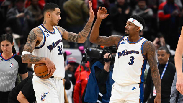 Washington Wizards guard Bradley Beal and forward Kyle Kuzma celebrate after the game against the Miami Heat.