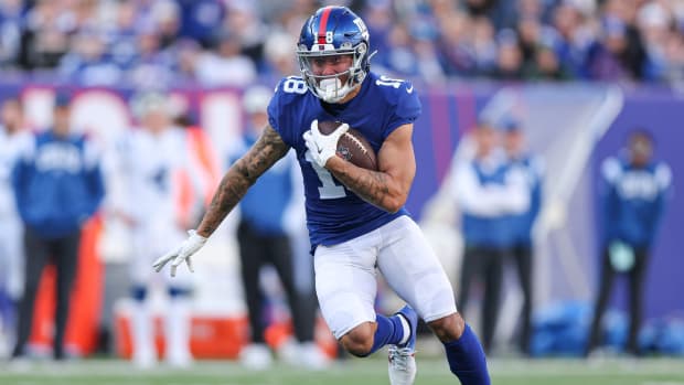 Jan 1, 2023; East Rutherford, New Jersey, USA; New York Giants wide receiver Isaiah Hodgins (18) gains yards after the catch during the first half against the Indianapolis Colts at MetLife Stadium.