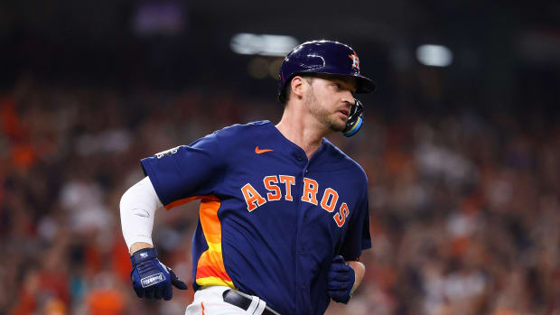 Nov 5, 2022; Houston, Texas, USA; Houston Astros first baseman Trey Mancini (26) runs to first after hitting a single against the Philadelphia Phillies during the third inning in game six of the 2022 World Series at Minute Maid Park.