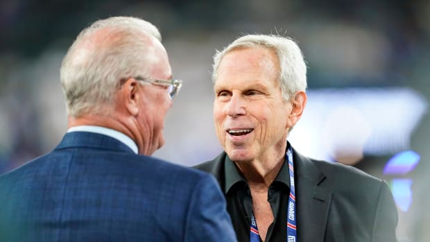 New York Giants co-owner Steve Tisch, right, on the field before the Giants face the Dallas Cowboys at MetLife Stadium on Monday, Sept. 26, 2022.