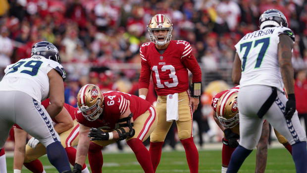 Brock Purdy calls out signals before the snap during a 49ers playoff win over the Seahawks