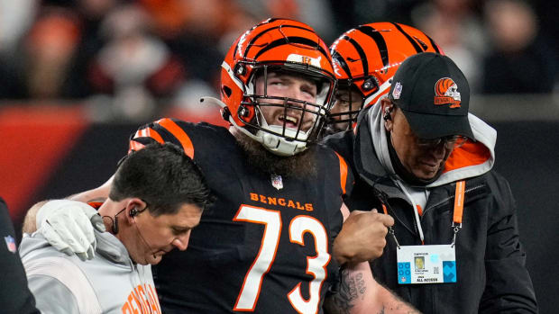 Bengals left tackle Jonah Williams is helped off the field after suffering an injury vs. the Ravens.