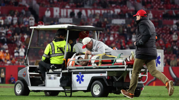 Buccaneers wide receiver Russell Gage is carted off the field during the team’s playoff loss to the Cowboys.