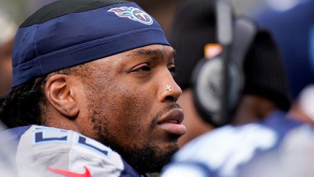 Tennessee Titans running back Derrick Henry (22) sits on the sidelines during the second quarter at Nissan Stadium.