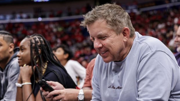 Apr 28, 2022; New Orleans, Louisiana, USA; Former New Orleans Saints head coach Sean Payton looks at his phone on a time out during the first half of game six of the first round for the 2022 NBA playoffs at Smoothie King Center.