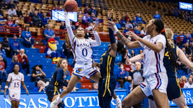 Wyvette Mayberry shoots the ball against the West Virginia Mountaineers in Allen Fieldhouse