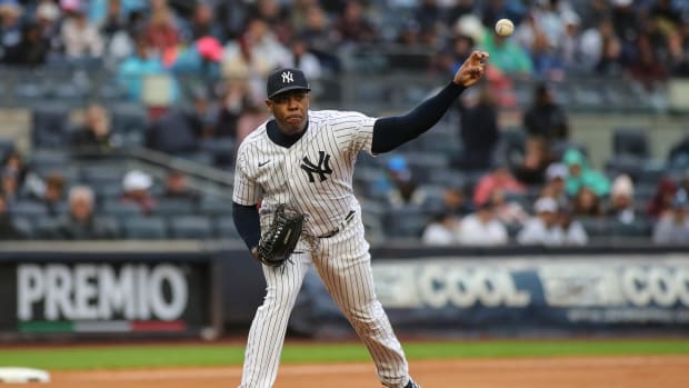 Oct 2, 2022; Bronx, New York, USA; New York Yankees relief pitcher Aroldis Chapman (54) throws to first on a pick off attempt in the seventh inning against the Baltimore Orioles at Yankee Stadium. Mandatory Credit: Wendell Cruz-USA TODAY Sports