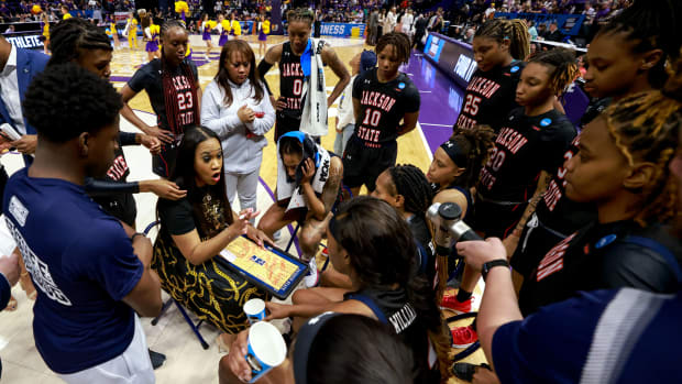 Jackson State coach Tomekia Reed speaks to her team during a NCAA tournament game against LSU.