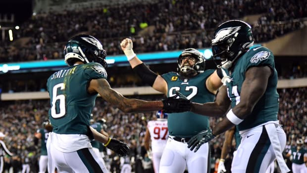 Jan 21, 2023; Philadelphia, Pennsylvania, USA; Philadelphia Eagles wide receiver DeVonta Smith (6) celebrates with wide receiver A.J. Brown (11) and center Jason Kelce (62) after scoring a touchdown in the first quarter against the New York Giants in an NFC divisional round game at Lincoln Financial Field.