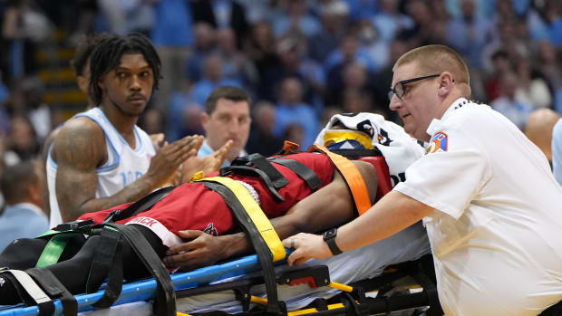 Jan 21, 2023; Chapel Hill, North Carolina, USA; North Carolina State Wolfpack guard Terquavion Smith (0) is taken off the court on a stretcher after being injured in the second half at Dean E. Smith Center.