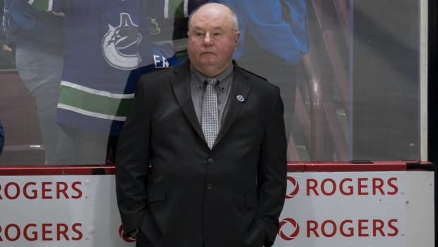 Canucks head coach Bruce Boudreau looks on during a game vs. the Avalanche.