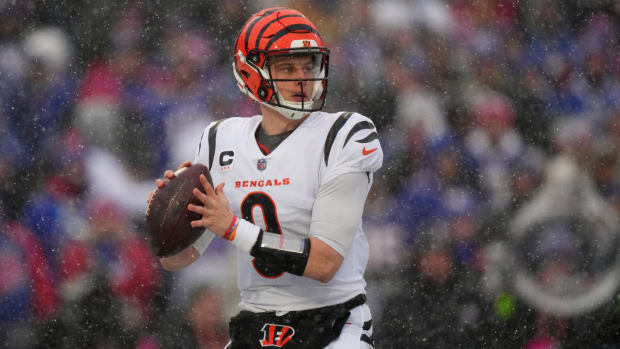 Cincinnati Bengals quarterback Joe Burrow (9) looks to throw in the first quarter during an NFL divisional playoff football game between the Cincinnati Bengals and the Buffalo Bills, Sunday, Jan. 22, 2023, at Highmark Stadium in Orchard Park, N.Y. Cincinnati Bengals At Buffalo Bills Afc Divisional Jan 22 0175